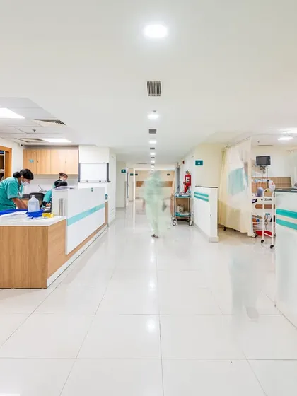 We design healthcare corridors and circulation spaces to be clear, efficient, and stress-free. This bright, well-lit hallway ensures intuitive wayfinding and supports the operational flow of a busy hospital, reflecting our commitment to creating accessible and well-regulated healthcare systems.