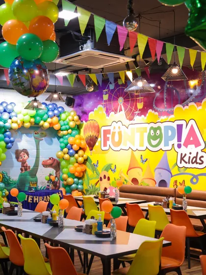 Welcome to the Jurassic world! This is a glimpse of our fully decorated Eatopia Cafe for a dinosaur-themed birthday bash. We handle every detail, from the balloon arrangements to the table settings, creating an immersive experience.