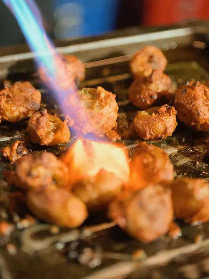Aloo Anmol, or Tandoori Stuffed Baby Potatoes, being torched for a smoky finish. This live-action element adds a bit of theatre to your event and enhances the flavour.