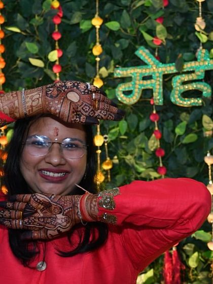 Another pose showing the wonderful stain color against the festive backdrop. My natural henna cones give this consistent, rich result.
