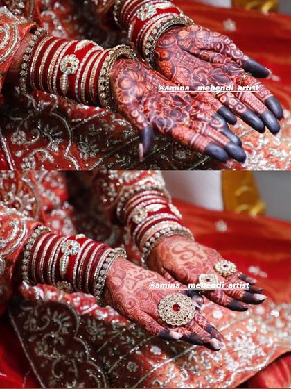 The contrast between the dark fingertips and the reddish-brown palm is a classic bridal look, and this photo captures it perfectly.