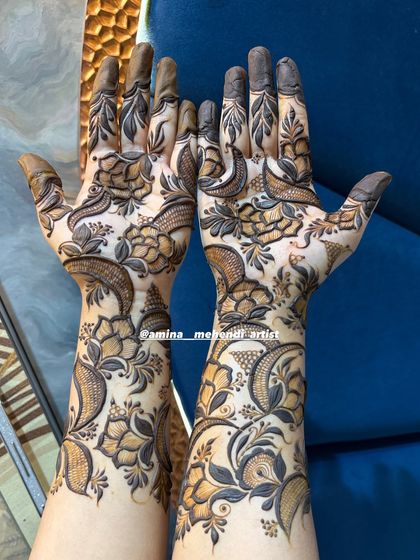 I love creating designs with negative space to make the floral patterns pop. This is a great example of a modern yet traditional bridal henna style.