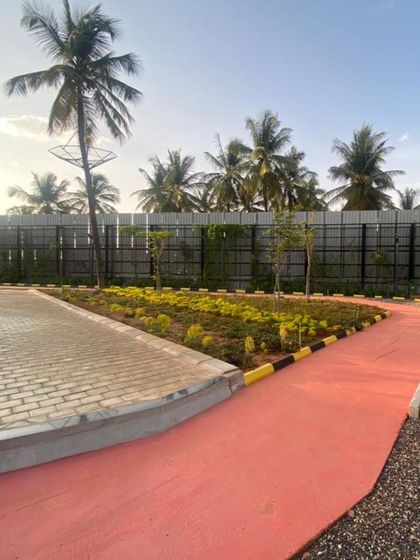 A finished section of the jogging track and adjacent planting at Vaishnavi Tech Square.