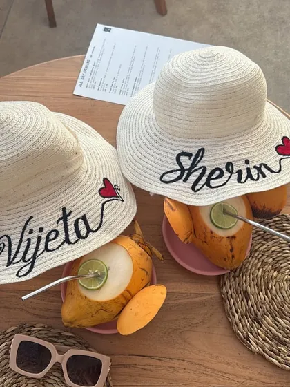 Our personalised beach hats styled with some refreshing coconut water. These hats are a must have for any tropical vacation or bachelorette party.
