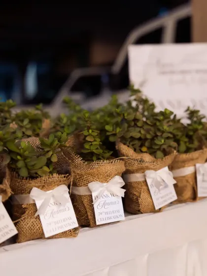 Thoughtful party favors for guests to take home. These lovely succulent plants, wrapped in burlap with a personalized thank you tag, were a beautiful and lasting reminder of the celebration.