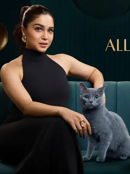 A sophisticated commercial portrait of actress Sharvari for Sheba. Working with animals requires patience, and this shot captures a gentle, luxurious moment between her and the cat.