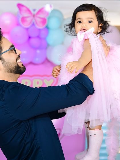 A charming 'Farm' themed birthday party, with rustic decor, animal cutouts, and hay bale props, perfect for a country-style celebration.