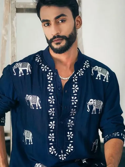 A navy blue kurta with a unique elephant motif embroidery in silver.