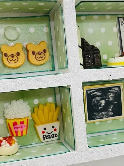 From burgers and fries to coffee and cake, this section represents all the cravings of the mom-to-be, complete with a miniature ultrasound photo.