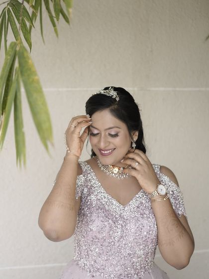A close-up on her happy expression, her makeup looking flawless.