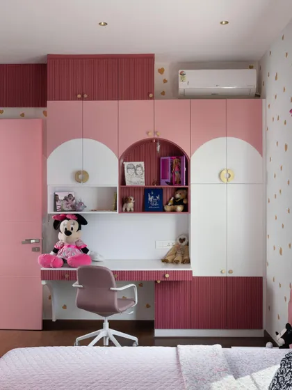 A Dreamy Pink Room Comes to Life: From a playful mood board of pinks and golds to detailed 3D renders, see how we brought this whimsical kid's bedroom to life. The final room, with its arched wardrobe details and integrated study, is a perfect match to the initial vision.