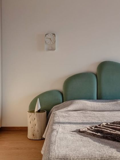 A sanctuary for a teenage girl, this bedroom is a symphony of color and light. The unique curved headboard in a soft teal and the warm sunlight create a canvas for endless inspiration and boundless imagination.