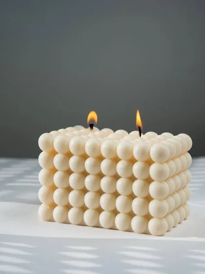 Our large double-wick bubble candle, lit and glowing. Get ready to fall in love with our candles all over again.