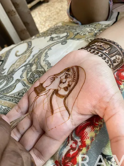 Here, I am adding the fine lines for the veil and shading. This video shows my steady hand and the precision required for portrait work.