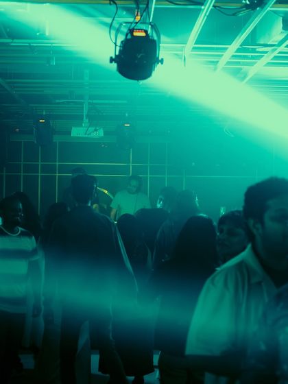 The crowd bathed in ethereal green light.