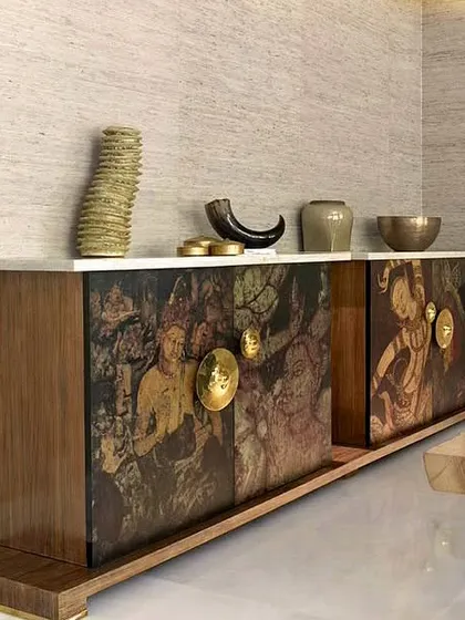 My art extends beyond walls. This custom credenza, created in collaboration with furniture designers, features artwork inspired by the ancient paintings of the Ajanta and Ellora Caves, turning a functional piece into a historic statement.