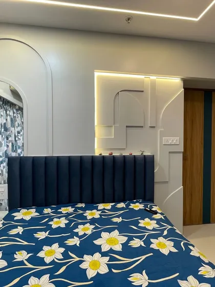 Another angle of the blue-themed room, showing the clean lines and the effective use of ambient lighting to create a calming mood.