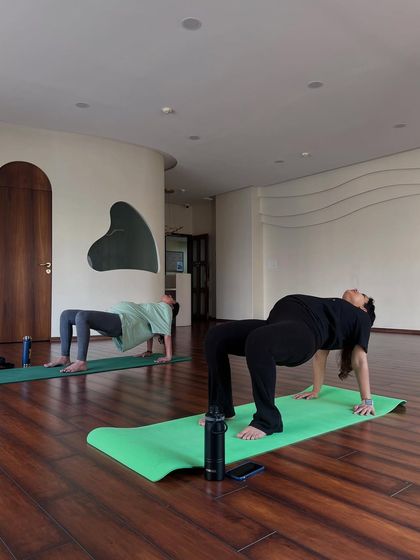 A student demonstrates strength and openness in Purvottanasana, the Upward Plank Pose. This posture helps to open the chest and shoulders while building strength in the arms and back.