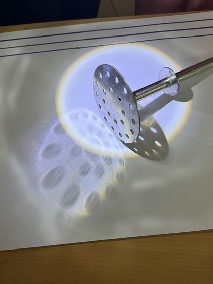 In our emergent literacy workshop, children explore light and shadow. By tracing the shadows of objects, they develop fine motor control and visual thinking, turning a science concept into a pre-writing and storytelling activity.