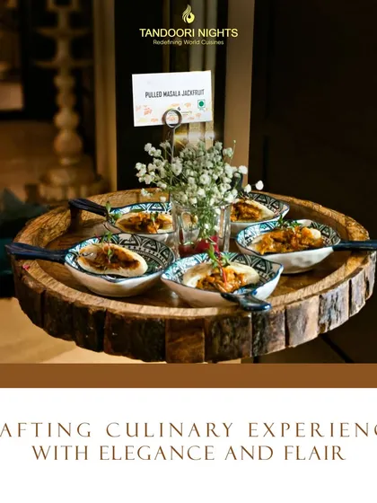 We craft culinary experiences with elegance and flair. Our pulled masala jackfruit is served in individual portions, beautifully presented on a wooden platter for easy enjoyment.