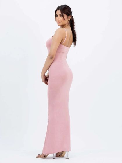 A side-profile view of the same pink dress, highlighting the garment's shape and fit on the body. Multiple angles are key to driving online sales and reducing returns.
