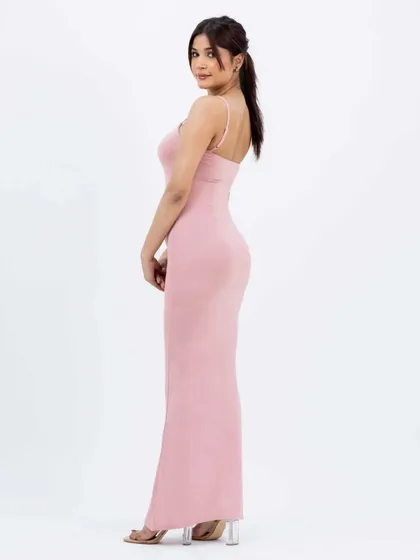 A side-profile view of the same pink dress, highlighting the garment's shape and fit on the body. Multiple angles are key to driving online sales and reducing returns.
