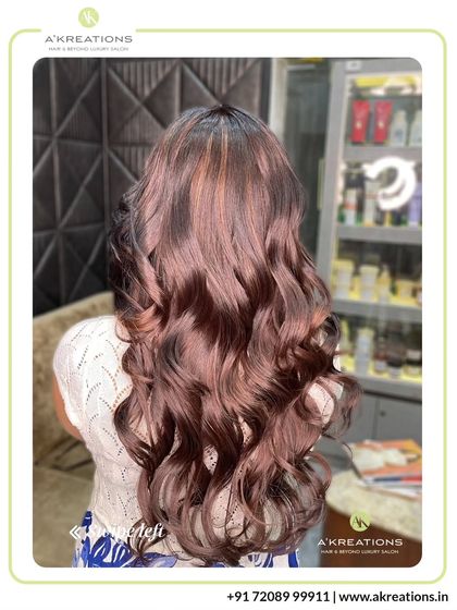 This client's transformation is a testament to our skill. We added rich, warm highlights and finished with glamorous curls for a complete style refresh.