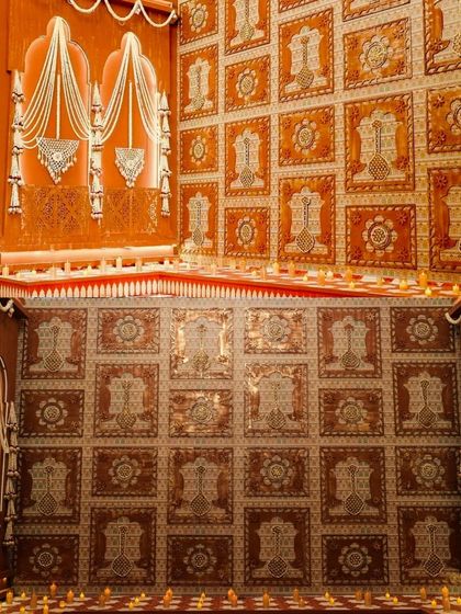A collage showing the intricate details of the South Indian wedding decor, including the hand-pasted floral panels and the ghungroo-adorned Ganesha.