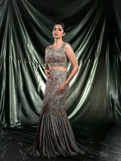 A full-length shot of the mermaid-style grey gown, demonstrating a high-fashion look.