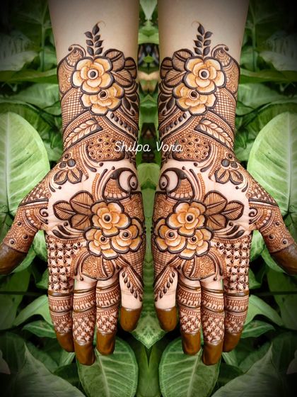 A classic floral design with large, beautifully shaded flowers, set against a natural green background.