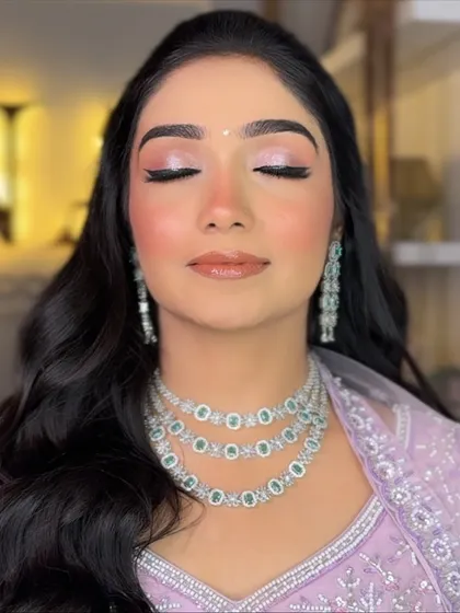 Soft glam for a bride-to-be's engagement. This look focuses on a radiant, dewy base, shimmering pink eyeshadow, and perfectly defined features to create an ethereal glow.