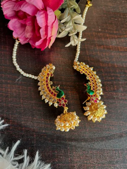 A beautifully styled shot of the Kundan and peacock Karnaphool.