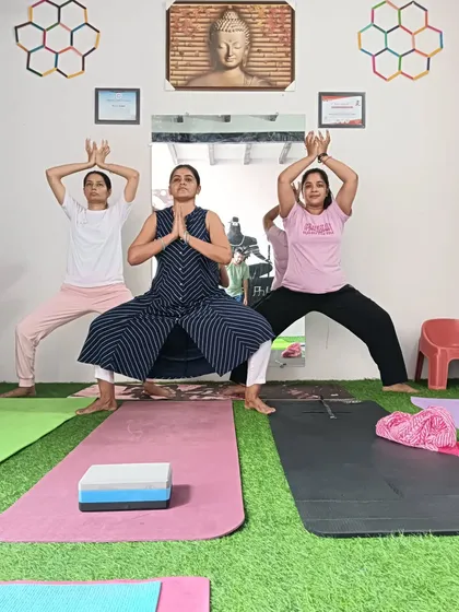 Students in Goddess pose. This is a powerful pose for building strength in the legs and opening the hips.