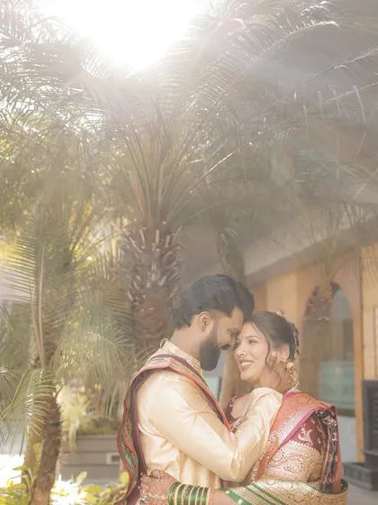 A dreamy, sun-kissed photo of the couple. The bride's makeup looks natural and luminous.