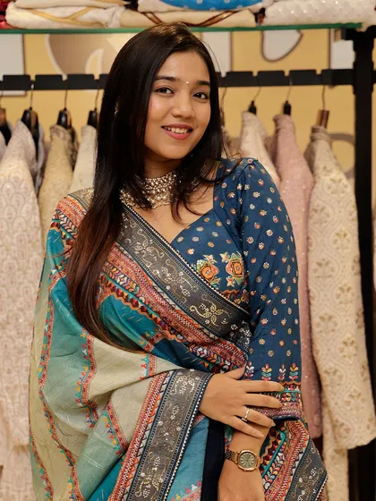 A close-up of the printed blue lehenga, showing the beautiful floral embroidery on the blouse.