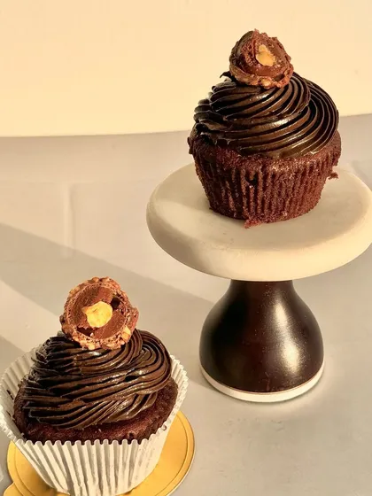 My Ferrero Rocher cupcakes are pure indulgence. They feature a rich chocolate cupcake base, a swirl of hazelnut frosting, and are topped with a whole Ferrero Rocher.