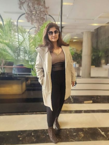 A full-length shot of my go-to monotone look, featuring shades of brown, a corset belt, and ankle boots. This is how you turn a style crisis into a win.