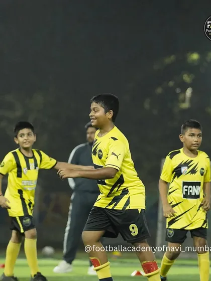 Players sharing a laugh during a drill, showing that training can be both productive and fun.