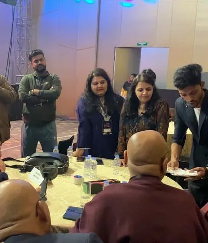 Performing for guests seated at their table during a corporate dinner. This table-side magic ensures all attendees get a front-row seat to the entertainment without leaving their conversations.