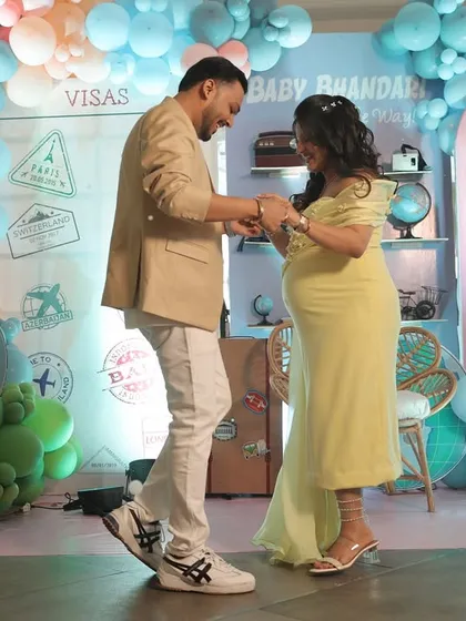 A candid moment of the happy couple dancing in front of the travel-themed backdrop. My goal is to create a space where you feel free to celebrate and make beautiful memories.