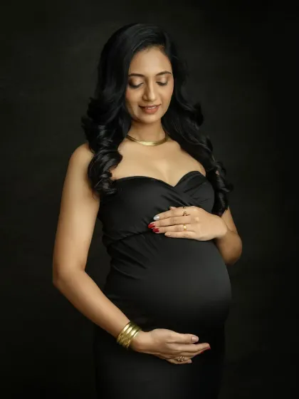 A close-up shot that captures your serene expression and the glow of motherhood. This simple yet stunning portrait is a beautiful tribute to your journey.