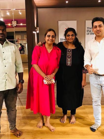 Our founder with proud parents and coaches. A strong support system is key to a student's success.