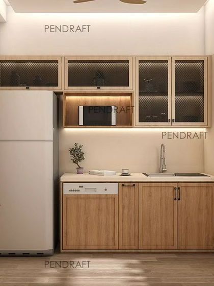 For this compact kitchen, we used earthy tones and MS jaali designs in the overhead cabinets to make the space feel lighter while providing ample storage. This view shows the pantry and fridge area.