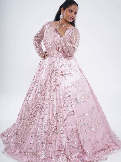 A beautiful pink sequence and motiwork ball gown. This is a classic, elegant choice for a formal event, reception, or anniversary party.
