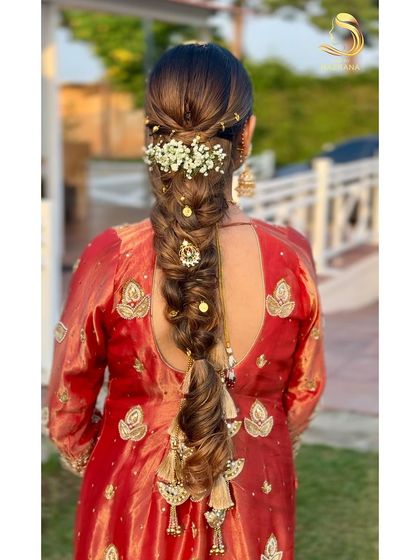 Another view of the messy braid, showing its texture and the placement of accessories.