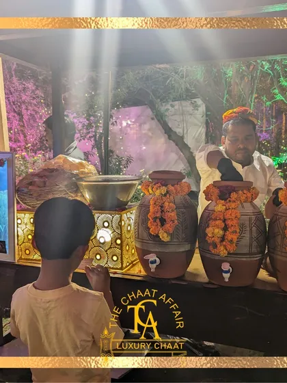 We excel at creating themed culinary experiences. For actress Swara Bhaskar's mehandi, we designed an authentic village theme, complete with rustic carts and earthen pots, serving traditional chaat that transported guests to the heart of old India.