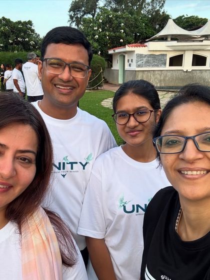 A selfie with my community members, all wearing "UNITY" t-shirts. We are a family that supports each other.