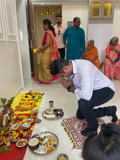 Seeking blessings during a housewarming ceremony. The first steps into a new home should be filled with reverence and positivity, setting the tone for years to come.