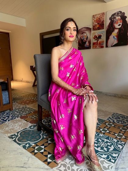 Fuchsia vibes for bride Deepali’s Haldi in Goa. We kept the makeup minimal and fresh but added a striking bright lip to match her radiant glow and fun, one-shoulder saree.