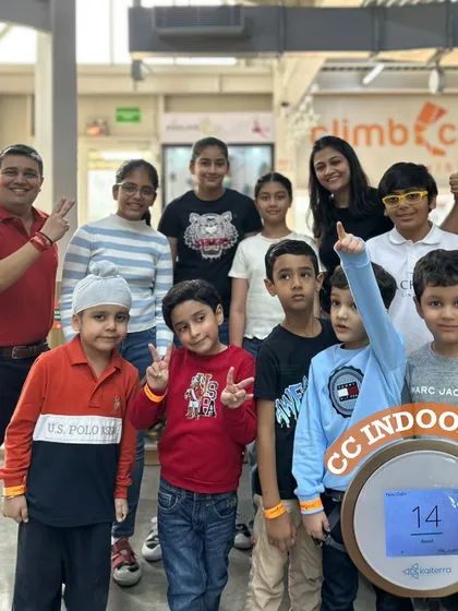 A happy group of kids posing with our indoor Air Quality Index monitor. We ensure a clean and healthy environment so your family can focus on having fun.